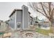 Backyard with a fire pit, patio, and lush greenery, perfect for relaxation and outdoor entertaining at 6365 Xavier Ct, Arvada, CO 80003