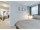 Cozy bedroom featuring neutral tones, artwork and comfortable furnishings, bathed in natural light at 6365 Xavier Ct, Arvada, CO 80003