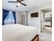 Bright bedroom featuring a bed, TV, and a peek into an adjacent bunk room at 6365 Xavier Ct, Arvada, CO 80003
