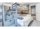 Charming bunk room with stylish gray bunk beds, storage drawers, and a neutral color scheme at 6365 Xavier Ct, Arvada, CO 80003