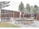 Outdoor fire pit area with stone accents and surrounding landscape, perfect for gatherings and relaxation at 6365 Xavier Ct, Arvada, CO 80003