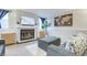 Inviting living room with a cozy fireplace, stylish decor, and comfortable seating arrangements at 6365 Xavier Ct, Arvada, CO 80003