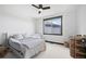 Cozy bedroom with neutral tones, ceiling fan, and a window bringing in natural light at 46692 Silver Fir St, Parker, CO 80138