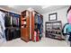 Spacious walk-in closet with custom shelving, storage drawers and ample room for clothes and accessories at 46692 Silver Fir St, Parker, CO 80138