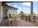 Wooden deck includes dining table with chairs and beautiful natural views at 46692 Silver Fir St, Parker, CO 80138