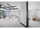 Bright main bedroom with a coffered ceiling, neutral decor, and an ensuite bathroom at 46692 Silver Fir St, Parker, CO 80138