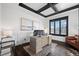 Bright home office with a large wooden desk, coffered ceiling and a window view at 46692 Silver Fir St, Parker, CO 80138