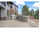 Outdoor kitchen with stainless steel grill and bar seating at 46692 Silver Fir St, Parker, CO 80138