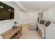 Finished basement has a large TV, a cozy seating area, and neutral carpet flooring at 6488 S Heritage E Pl, Centennial, CO 80111