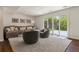 Finished basement featuring a seating area and access to the backyard at 6488 S Heritage E Pl, Centennial, CO 80111