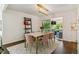 Dining room with marble table, seating for six and access to the patio through glass sliding doors at 6488 S Heritage E Pl, Centennial, CO 80111