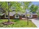 Beautiful home with lush lawn, mature trees, and brick accents at 6488 S Heritage E Pl, Centennial, CO 80111