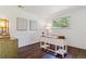 Well-lit home office featuring hardwood floors and a stylish writing desk at 6488 S Heritage E Pl, Centennial, CO 80111