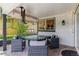 Covered patio featuring an outdoor dining area with a glass table and wicker chairs with decorative cushions at 6488 S Heritage E Pl, Centennial, CO 80111