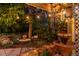 Relaxing backyard featuring a decorative water feature surrounded by lush greenery and lighting at 8291 S Krameria Way, Centennial, CO 80112