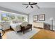 The spacious main bedroom features a vaulted ceiling, large windows, a plush rug, and elegant furnishings at 8291 S Krameria Way, Centennial, CO 80112