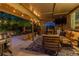 Inviting covered patio with comfortable seating, a built-in grill, and a cozy outdoor ambiance at 8291 S Krameria Way, Centennial, CO 80112