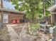 Private backyard featuring a patio, grilling area, and lush greenery at 2303-2305 W 32Nd Ave, Denver, CO 80211