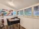 Cozy dining area featuring wainscoting, multiple windows, and unique decor at 2303-2305 W 32Nd Ave, Denver, CO 80211