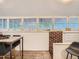 Charming dining room with wainscoting, brick accents, and abundant natural light at 2303-2305 W 32Nd Ave, Denver, CO 80211