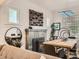 Cozy dining room with stylish decor, a decorative fireplace, and a view into the living space at 2303-2305 W 32Nd Ave, Denver, CO 80211
