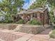 Charming brick home with landscaped front yard and brick paved sidewalk at 2303-2305 W 32Nd Ave, Denver, CO 80211