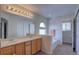 Well-lit bathroom featuring a double vanity, soaking tub, and modern fixtures at 10272 Fawnbrook Ct, Highlands Ranch, CO 80130