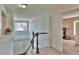Second story hallway features natural light and access to bedrooms and a bonus room at 10272 Fawnbrook Ct, Highlands Ranch, CO 80130