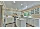 Well-appointed kitchen with stainless steel appliances, a center island and plenty of natural light at 10272 Fawnbrook Ct, Highlands Ranch, CO 80130