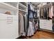 Organized walk-in closet featuring custom shelving and ample storage space for clothing and accessories at 7065 E Caley Ave, Centennial, CO 80111