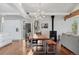 Dining room features an open concept floorplan and a rustic modern dining table at 7065 E Caley Ave, Centennial, CO 80111