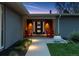 Inviting front entrance with a stylish door, bright lighting, and cozy seating, enhancing the home's appeal at 7065 E Caley Ave, Centennial, CO 80111