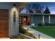 Charming home featuring a well-manicured lawn, decorative lighting, and eye-catching curb appeal at 7065 E Caley Ave, Centennial, CO 80111