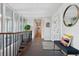 Bright and airy hallway with large windows, modern decor, and stylish tile flooring, enhancing the interior's appeal at 7065 E Caley Ave, Centennial, CO 80111