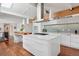 Modern kitchen featuring a large island, stainless steel appliances, sleek cabinetry, and stylish pendant lighting at 7065 E Caley Ave, Centennial, CO 80111