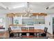 Dining area shows contemporary light fixture and modern kitchen with stainless steel appliances at 7065 E Caley Ave, Centennial, CO 80111