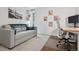 Comfortable office space with a sleek desk, sofa, and decorative wall art at 7065 E Caley Ave, Centennial, CO 80111