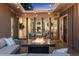 Inviting covered patio with a fire pit and string lights, perfect for outdoor entertaining at 7065 E Caley Ave, Centennial, CO 80111