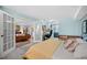 Open bedroom layout with French doors that connects to the living room and a blue closet with shelves at 1301 Speer Blvd # 207, Denver, CO 80204
