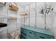 Organized walk-in closet with wire shelving and a turquoise dresser for storage at 1301 Speer Blvd # 207, Denver, CO 80204