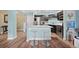 Bright kitchen with a breakfast bar, sleek cabinetry, and stainless steel appliances at 1301 Speer Blvd # 207, Denver, CO 80204