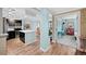 Well-lit living area shows an open floor plan and adjacent kitchen with a breakfast bar at 1301 Speer Blvd # 207, Denver, CO 80204