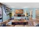 Stylish living room features a mounted TV, decorative lighting, and a comfortable seating area at 1301 Speer Blvd # 207, Denver, CO 80204