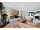 Relaxing living room boasts an open layout with a modern TV setup and adjacent kitchen at 1301 Speer Blvd # 207, Denver, CO 80204