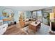 Inviting living room leads to a balcony and features natural light and comfortable seating at 1301 Speer Blvd # 207, Denver, CO 80204