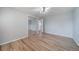 Expansive bedroom featuring hardwood floors, mirrored closet doors, and ample natural light at 5404 W Rowland Pl, Littleton, CO 80128