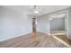 Bright bedroom showcases hardwood floors and mirrored closet doors at 5404 W Rowland Pl, Littleton, CO 80128