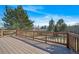 Elevated deck features wood flooring, railing and scenic views at 5404 W Rowland Pl, Littleton, CO 80128