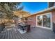 Outdoor deck features dining furniture and overlooks a yard at 5404 W Rowland Pl, Littleton, CO 80128