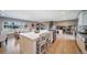 Open kitchen with large island, stainless appliances, and lots of open space for entertaining at 5404 W Rowland Pl, Littleton, CO 80128